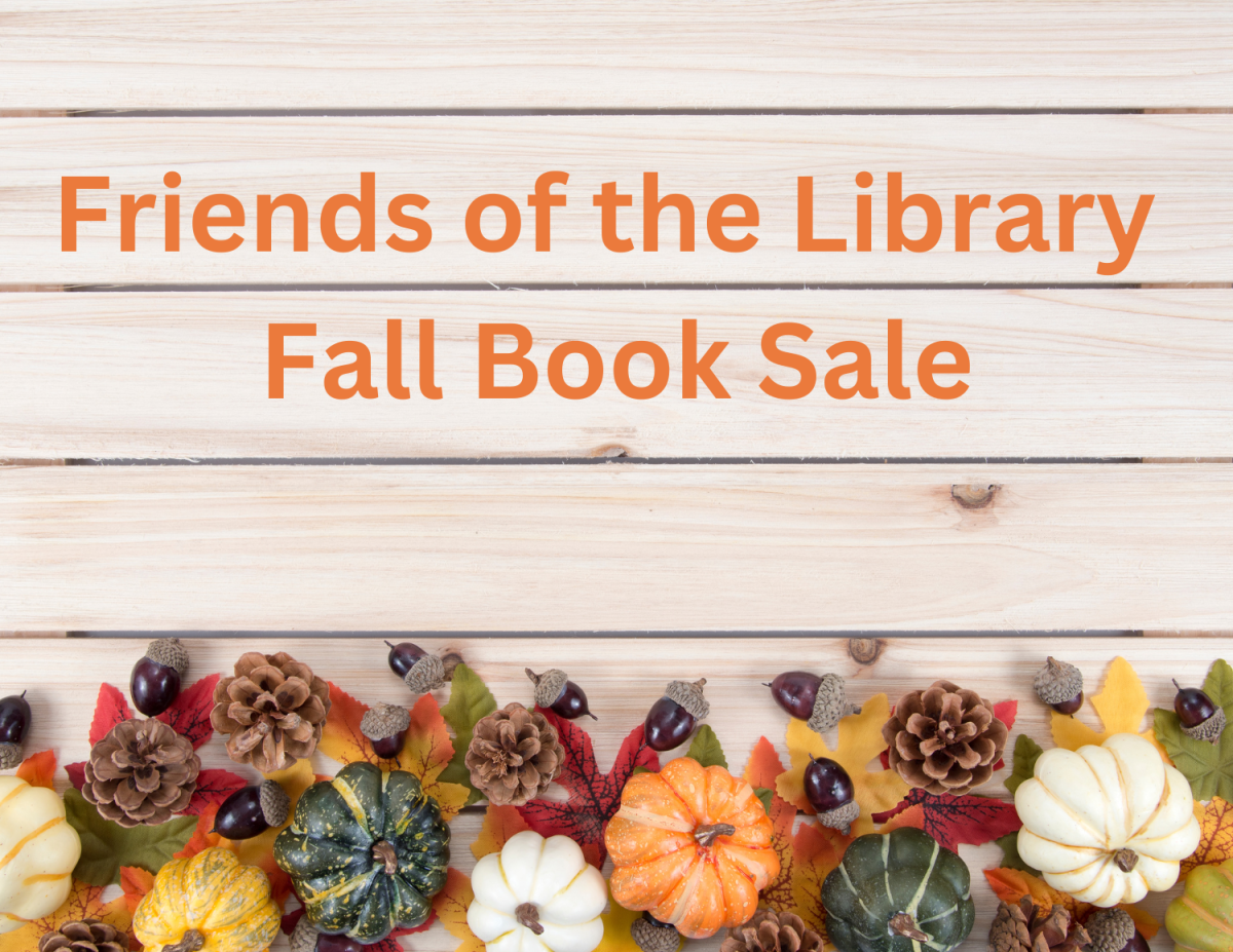 Slatwood wall with fall gourds and Friends Book Sale Announcement